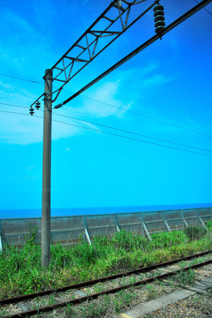 Railway track with view of seaの写真素材