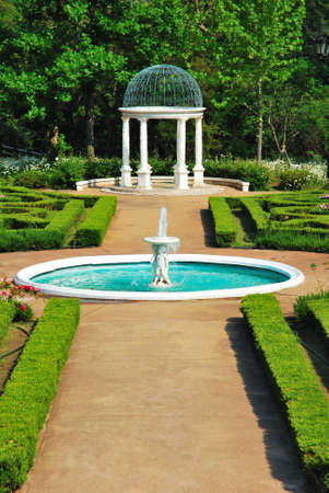 Water fountain and pavilion in a European-styled gardenの写真素材