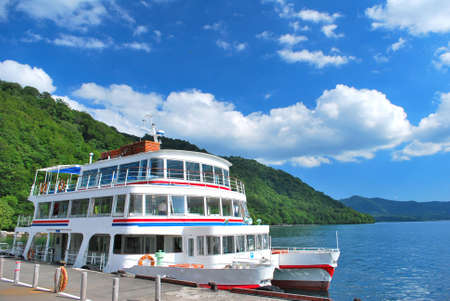 Docked passenger ship. Suitable for concepts such as travel and vacation, relaxation, tourism, and generic transportation.の写真素材