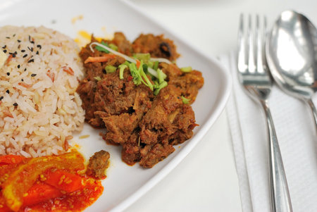 Vegetarian rendang chicken or mutton with unpolished red rice. Suitable for concepts such as diet...