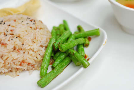 Healthy unpolished red rice and beans. Suitable for concepts such as diet and nutrition, healthy lifestyle, and food and beverage.の写真素材