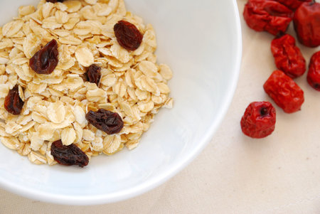 Small serving of healthy cereal with oatmeal to signify concepts such as dieting, and healthy eating...