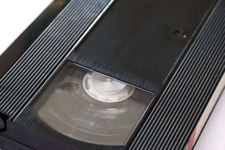 Old, moldy video tape and cds signifying modernization and advancement in technology.の写真素材