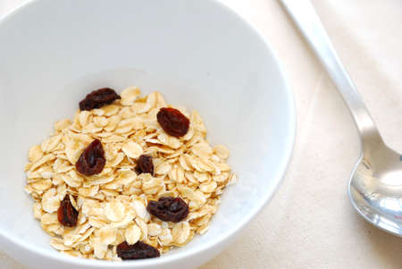 Small serving of healthy cereal with oatmeal to signify concepts such as dieting, and healthy eating and lifestyle. Also for healthy and nutritious breakfasts, nutrition, and food and beverage concepts.の写真素材