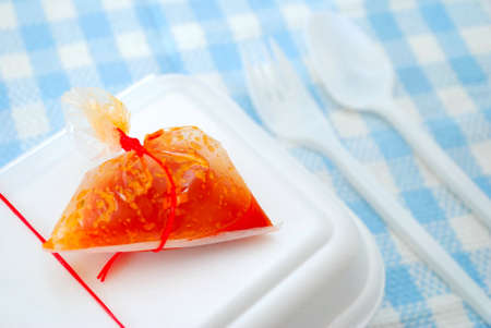 Packed meal takeaway with fork and spoon. Suitable for concepts such as diet and nutrition, busy work life, and food and beverage.の写真素材