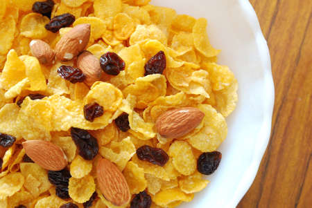 Cereal with raisins and nuts for a nutritious and healthy breakfast or meal. Also for healthy eating and lifestyle, diet and nutrition, and food and beverage concepts.の写真素材
