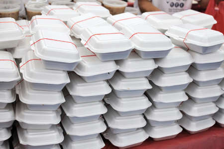 Packed meals in white containers. Suitable for concepts such as diet and nutrition, busy work life, and food and beverage.の写真素材