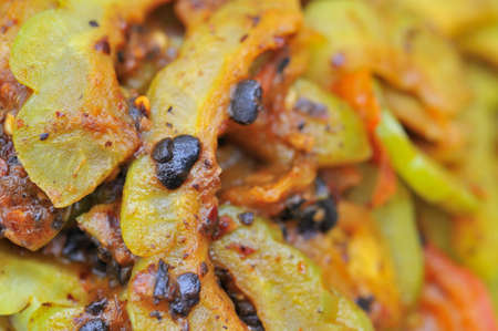 Closeup of bitter gourd delicacy stir fried in tasty black bean sauce. Concepts such as food and beverage, healthy living, and diet and nutrition.の写真素材