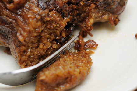 Macro shot of fork on delicious meat dumpling. For food and beverage, customs and traditions, and...