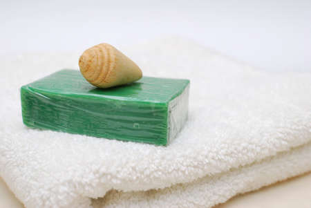Closeup of spa and wellness soap and towel. For spa and hygiene, alternative healthcare, and relaxation concepts.の写真素材