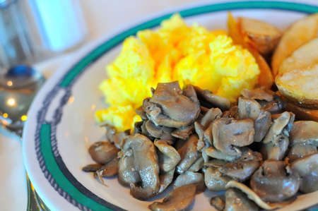 Delicious mushrooms and scrambled egg for a healthy and nutritious breakfast.の写真素材