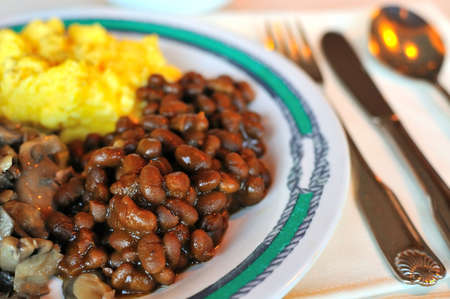 Seasoned beans and other side dishes at restaurant.の写真素材
