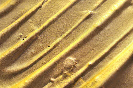 Abstract golden texture with diagonal patterns. Suitable for abstract backgrounds and textures.の写真素材
