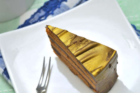 Closeup shot of slice of cake on white plate.の写真素材