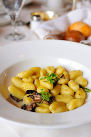 Traditional Italian Gnocchi served on white plate.の写真素材