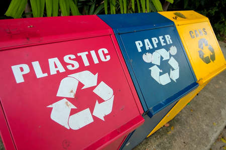 Colorful recycle bins for plastic, paper and metal waste for environment conservation.の写真素材