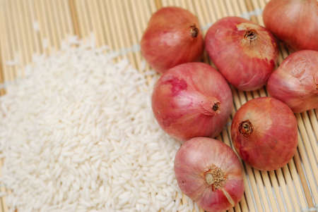 Typical Asian food ingredients commonly used in cooking such as onions and rice.の写真素材