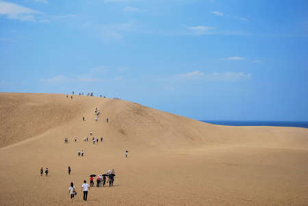 JAPAN - SEPTEMBER 2: People and tourists climbing huge sand dunes in Tottori, Japan.のeditorial素材