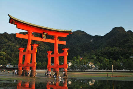 Majestic torii gate taken on September 4, 2008 in Hiroshima, Japan. Tourists can walk out to the gate during low tide.のeditorial素材