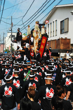 JAPAN - SEP 13: Danjiri festival held on Sept 13, 2008 in Kishiwada ward, Osaka, Japan. In this event, huge and heavy floats are supported by a team of male participants and used in races against other teams.のeditorial素材