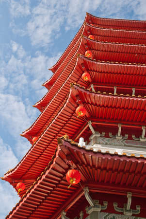 Oriental Chinese pagoda tower details with red lanterns.の写真素材