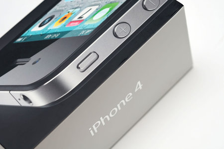 New Apple iPhone 4 in product box with white background.