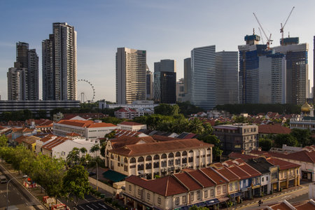 Sunset of city with historical shophouses and towering skyscrapers in the background. Taken 12...