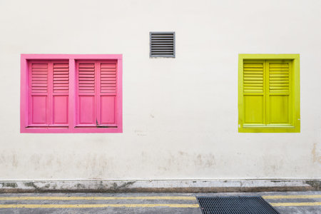 Colourful and traditional looking windows along street.の写真素材
