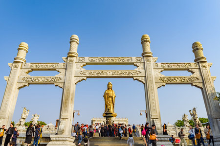 Zhejiang, China - 03 November 2017: Golden Guan Yin Buddha statue.