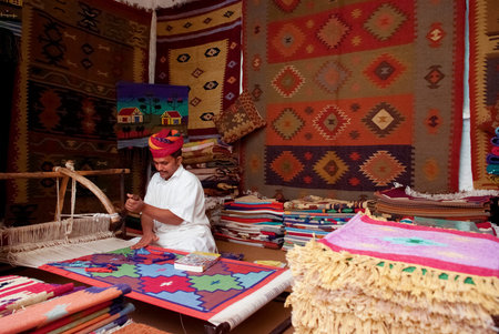 JODHPUR, INDIA â FEB 28  A craftsman uses a handloom to produce rugs and tapestries on Feb 28, 2013 in Jodhpur, India   The handloom sector is known for its heritage and the tradition of excellent craftsmanship of India のeditorial素材