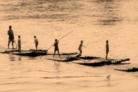 KANCHANABURI, THAILAND - SEPTEMBER 22:  Local people use attached rafts as a means to travel by a river on September 22, 2007 in Kanchanaburi, Thailand. Kanchanaburi is known for jungles and the exotic charm of its rural villages.のeditorial素材