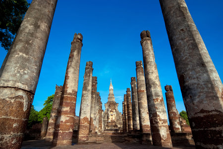 A stupa and columns in the ordination hall at Mahathat Temple in Sukhothai, Thailandの写真素材