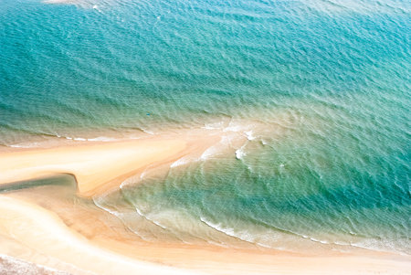 Tropical beach with turquoise water and golden sand in Thailandの写真素材