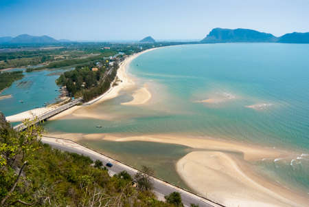 Tropical beach with turquoise water and golden sand in Thailandの写真素材