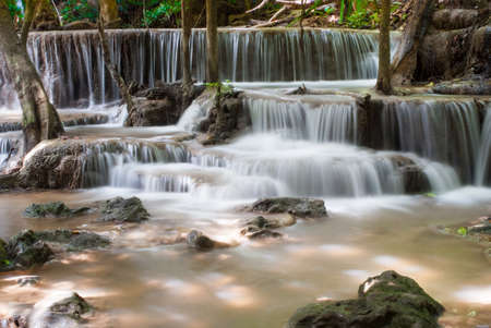 Waterfalls cascading off small cliffs into a poolの写真素材
