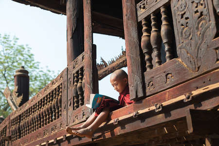 BAGAN, MYANMAR MAR 2: a young novice stydying at Nat Taung Kyaung Monastery on Mar 2, 2015 in Bagan, Myanmar. Boys at 8-20 years old have to enter the Buddhist Order as a novice.のeditorial素材