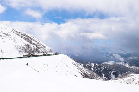 Snowcovered and slippery road to Huanglong Chinaの写真素材