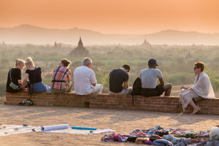 BAGAN, MYANMAR â MAR 03: Tourists enjoy sunset over the Bagan pagodas from Pyathatgyi Temple on Mar 03, 2015 in Bagan, Mandalay.のeditorial素材