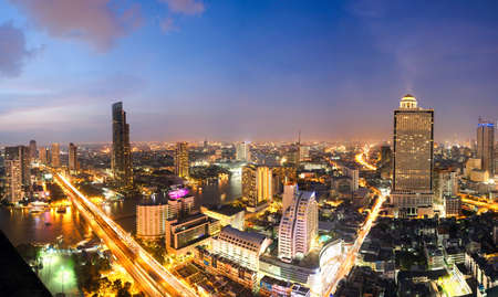 Overview of one of the most important financial districts with bank headquarters, financial institutions and office buildings in Bangkok at sunsetのeditorial素材