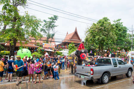AYUTTHAYA, THAILAND - APR 13:  Revelers and elephants join in water splashing during Songkran Festival on Apr 13, 2015 in Ayutthaya, Thailand.  The water festival has long been observed as New Year for Thai people.のeditorial素材