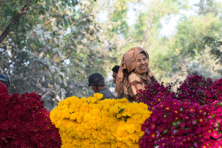 MANDALAY, MYANMAR - FEB 2, 2016: Vibrant morning market on the roadside to Mandalay on Feb 2, 2016.  Flowers are principally used in Myanmar as offerings to Buddha, both in homes and temples.のeditorial素材