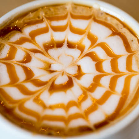 Close up of the caramel pattern on the top of coffeeの写真素材