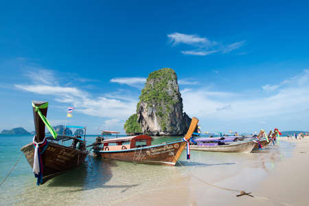 KRABI, THAILAND â DEC 5, 2015: long-tailed boats for tourists are docked along the Phra Nang Cave Beach which is one of the most strikingly beautiful beaches in Thailandのeditorial素材