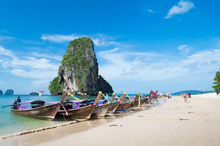 KRABI, THAILAND â DEC 5, 2015: long-tailed boats for tourists are docked along the Phra Nang Cave Beach which is one of the most strikingly beautiful beaches in Thailandのeditorial素材
