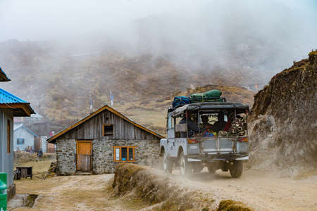 DARJEELING, INDIA - NOVEMBER 29, 2016: a tourist jeep passes through Singalila National Park.  It is the route to Sankakphu and Phalut, the two highest peaks of Singalila range.のeditorial素材