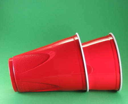 party picnic and celebration disposable red plastic cupsの写真素材
