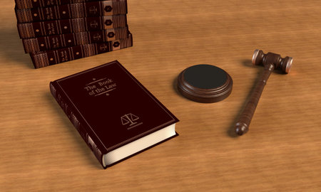 Lying book and a wooden gavel of judges on the table. Books in the background. 3d rendering