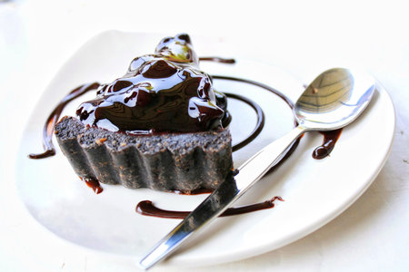 Chocolate cake with chocolate cream on plateの写真素材
