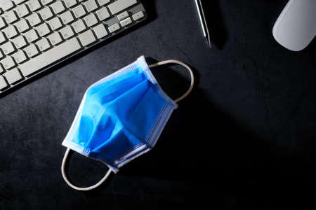 Medical mask on the desk in top view.の写真素材