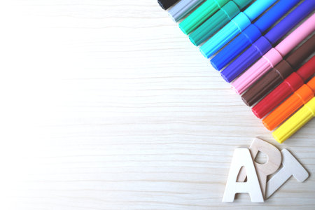 The word ART, Wooden letters on a wooden table, Top view.